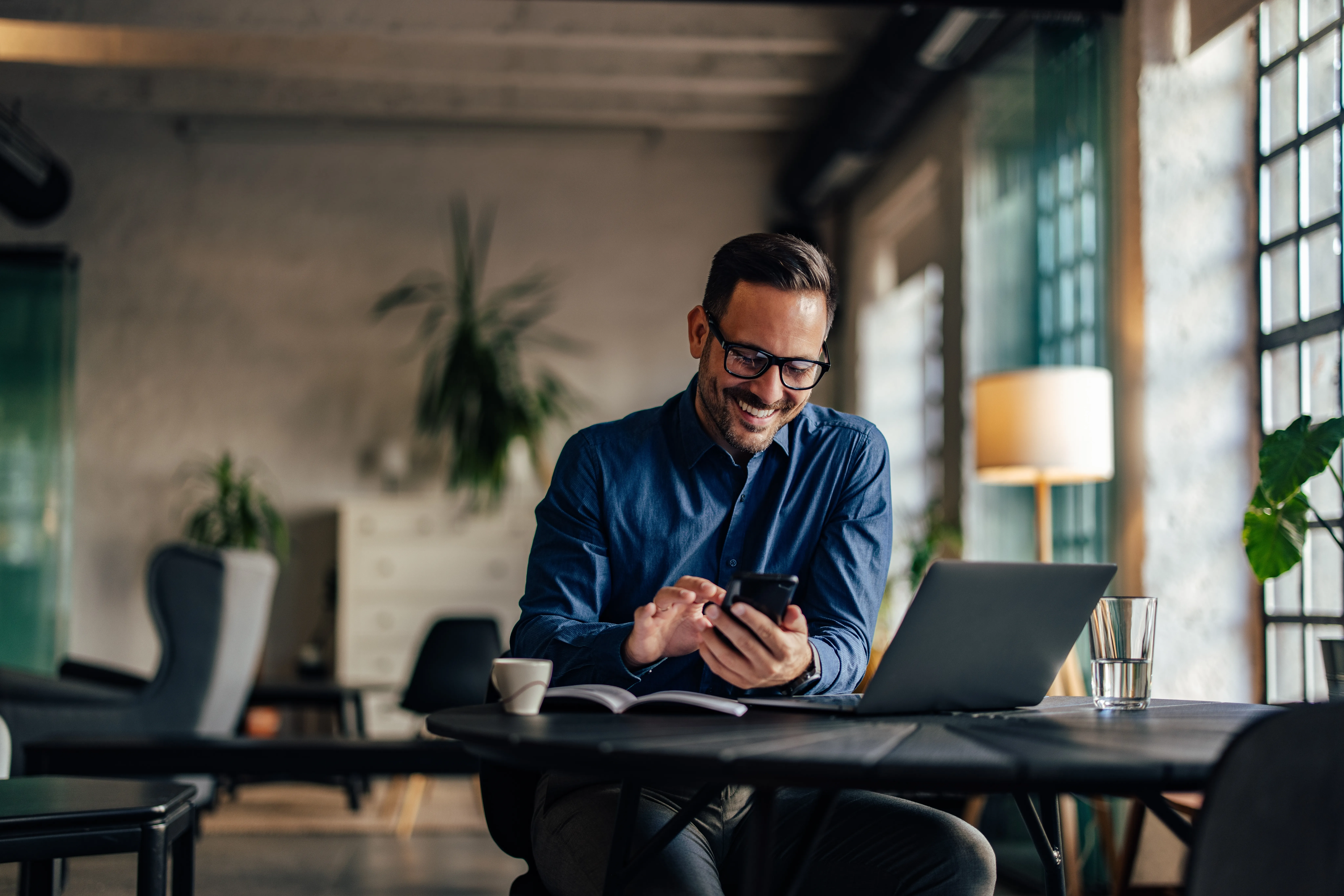 Smiling freelancer working in a modern office