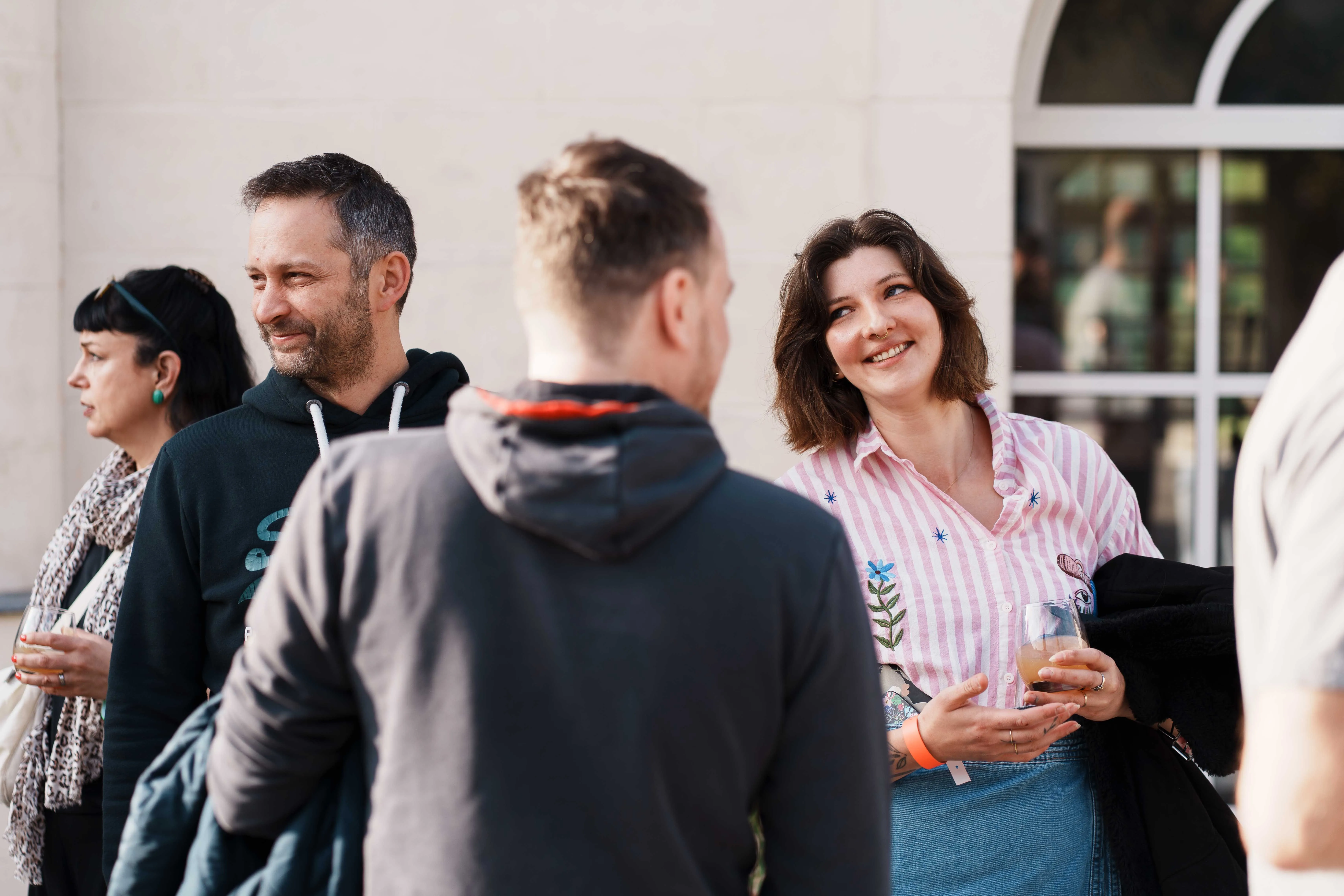 Woman working from home, smiling at her laptop