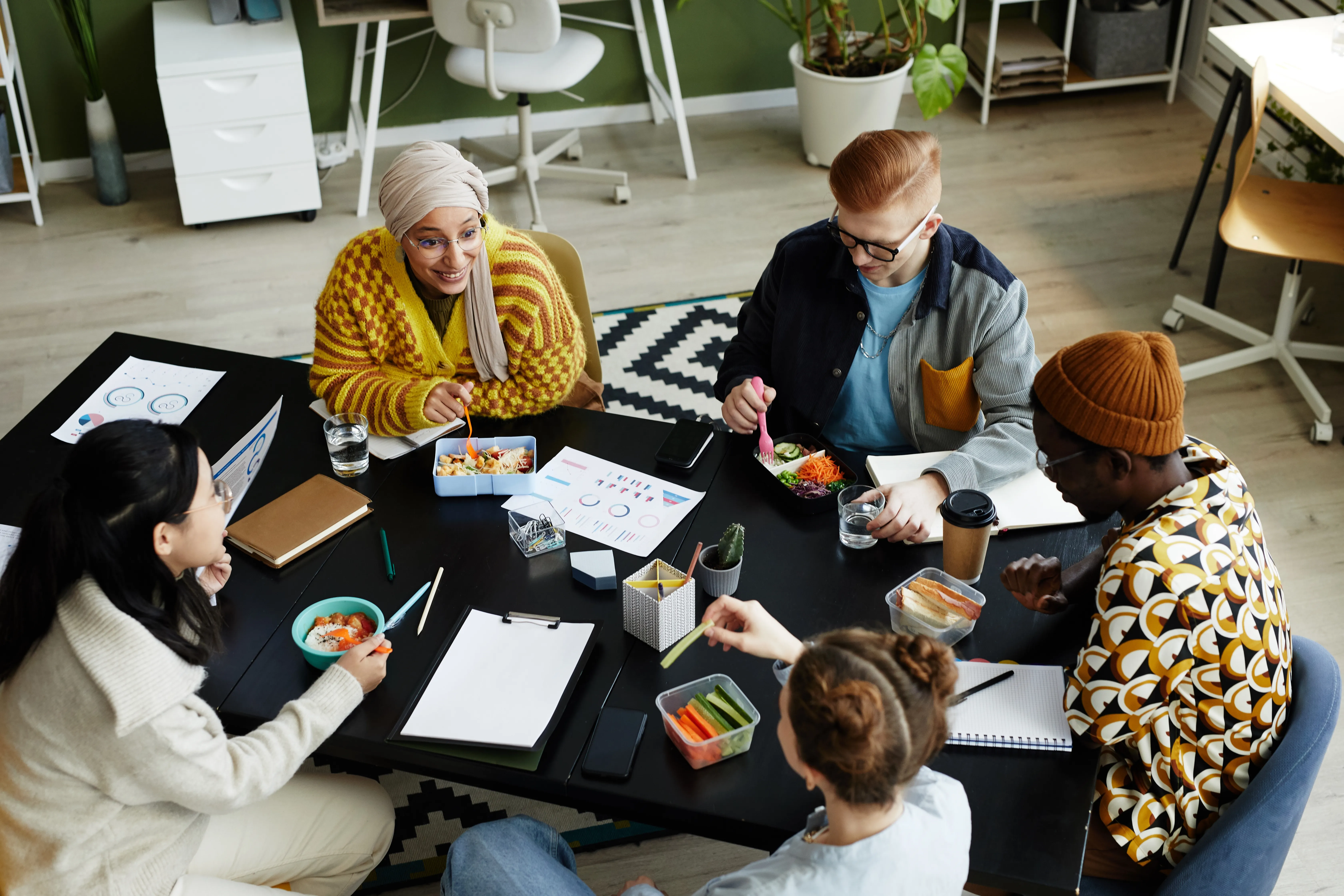 Diverse team enjoying lunch together at the office