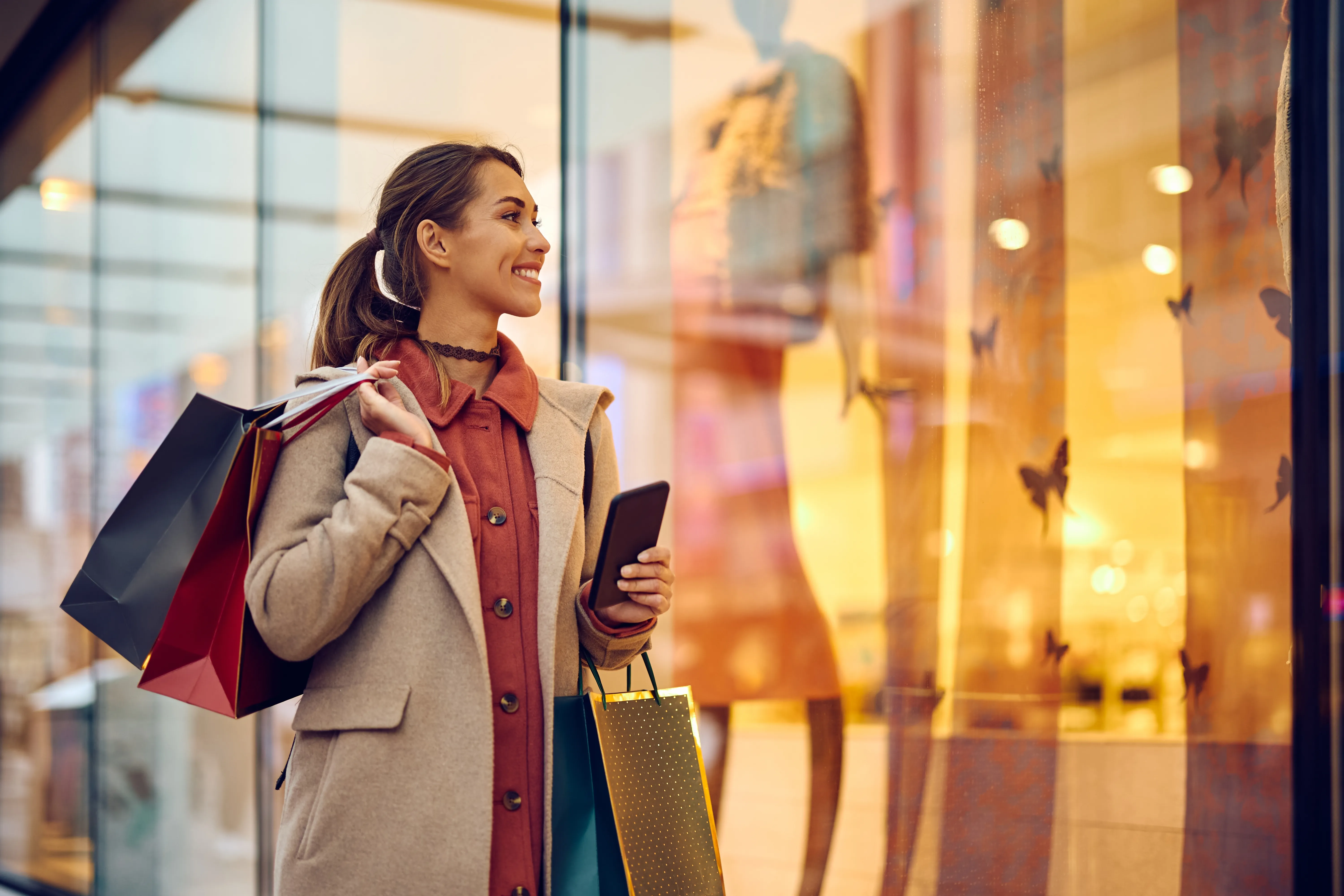 Woman shopping in the city with bags